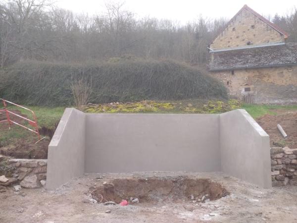 MACONNERIE MUR EN BLOCS A BANCHER AVEC FINITION ENDUIT BETON